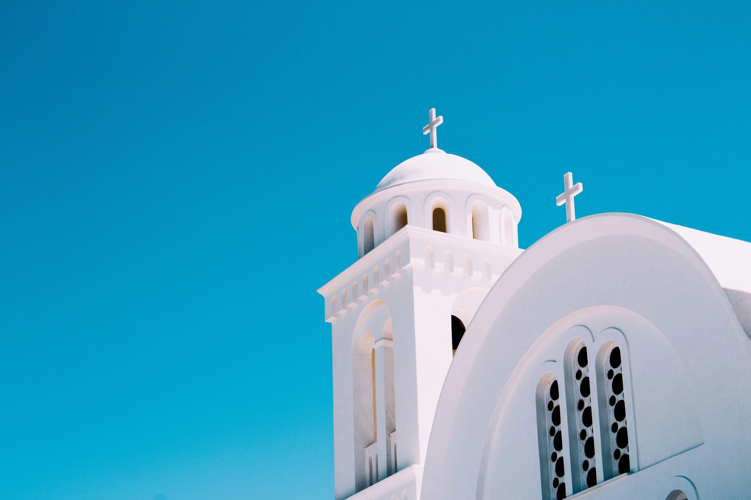 White Greek Kyra and Tower Meet Clear Blue Sky