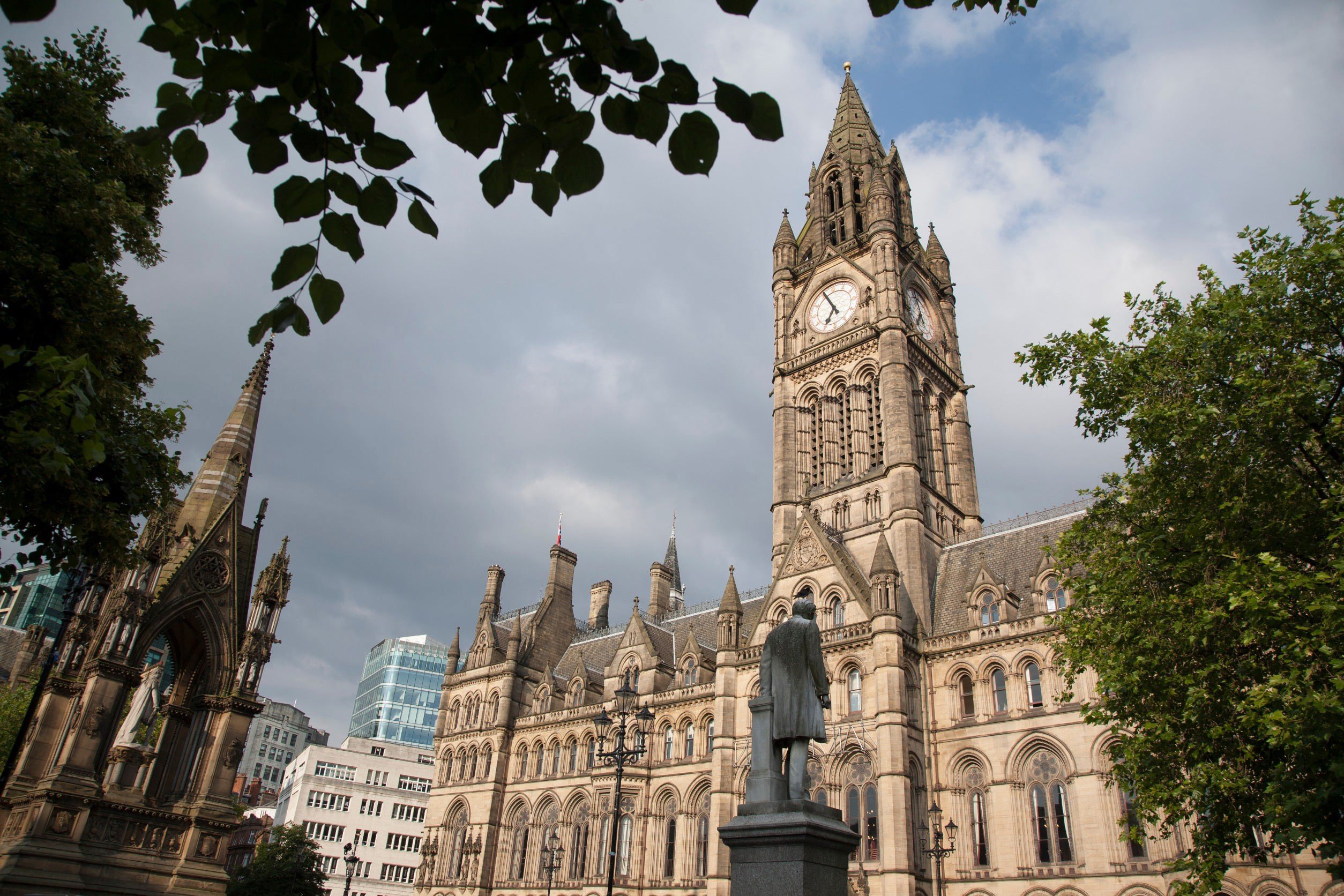 Picture of famous church in Manchester with traditional British architecture and trees around it